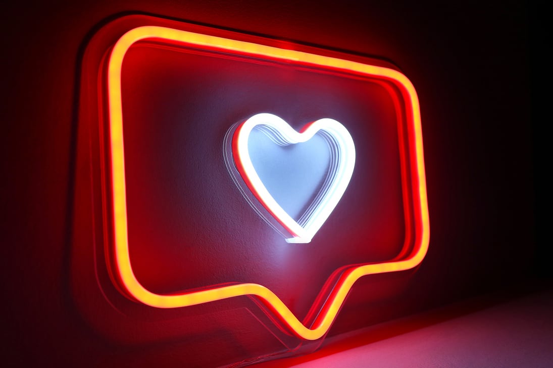 Neon sign red and white like Instagram heart in the decor. Trendy style. Valentine day.